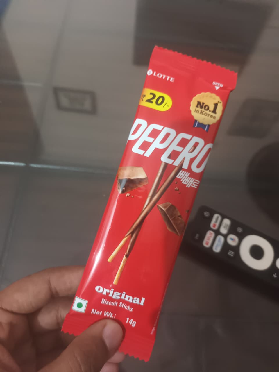Me holding a red Pepero packet