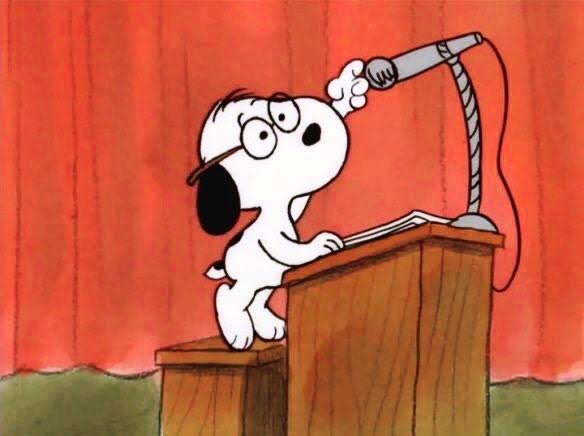 an image of snoopy the dog, fixing the mic while standing behind a podium before he gives his speech on something